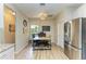 Bright office space with a wood desk and two chairs, located near the kitchen at 350 River Enclave Ct, Bradenton, FL 34212