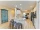 Spacious kitchen featuring granite countertops, stainless steel appliances, and light wood flooring at 350 River Enclave Ct, Bradenton, FL 34212