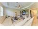 L-shaped living room with large sectional sofa and wood flooring at 350 River Enclave Ct, Bradenton, FL 34212