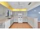 Bright kitchen with gray cabinets and a yellow ceiling detail at 5400 34Th W St # A17, Bradenton, FL 34210