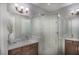 Elegant bathroom with a large walk-in shower and dual vanity at 15025 Shady Palms Ln, Nokomis, FL 34275