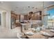Modern kitchen with island, stainless steel appliances, and dining area at 15025 Shady Palms Ln, Nokomis, FL 34275