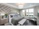 Spacious primary bedroom featuring a large bed, elegant decor, and a sitting area at 15076 Shady Palms Ln, Nokomis, FL 34275