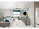 Spacious bonus room with comfortable seating, large TV, and plenty of natural light at 15076 Shady Palms Ln, Nokomis, FL 34275