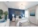 Bright bedroom with a comfy bed, stylish decor, and large window at 15076 Shady Palms Ln, Nokomis, FL 34275