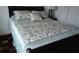 Bedroom with a double bed and patterned bedding at 7365 Black Walnut Way, Lakewood Ranch, FL 34202