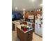 Kitchen with island and stainless steel appliances at 7365 Black Walnut Way, Lakewood Ranch, FL 34202