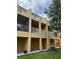 Building exterior with balconies and landscaping at 7365 Black Walnut Way, Lakewood Ranch, FL 34202