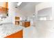 Open kitchen with granite countertops and wood cabinets at 4005 Belladonna Ave, North Port, FL 34286