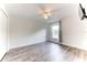Bright bedroom with wood-look flooring and ceiling fan at 4005 Belladonna Ave, North Port, FL 34286