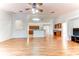 Spacious living room with hardwood floors and ceiling fan at 4005 Belladonna Ave, North Port, FL 34286