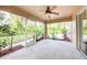 Spacious screened porch with tile flooring and ceiling fan at 4005 Belladonna Ave, North Port, FL 34286