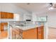 Island kitchen with granite countertops and wood cabinets at 4005 Belladonna Ave, North Port, FL 34286