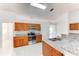 View of kitchen with granite countertops and wood cabinets at 4005 Belladonna Ave, North Port, FL 34286