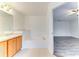 Bathroom with soaking tub, double vanity, and access to bedroom at 4005 Belladonna Ave, North Port, FL 34286