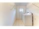 Bright laundry room with washer, dryer, and ample shelving at 4005 Belladonna Ave, North Port, FL 34286