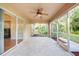 Bright screened porch with tile floor and access to backyard at 4005 Belladonna Ave, North Port, FL 34286