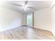 Bedroom featuring wood-look flooring and a window with gray curtains at 4005 Belladonna Ave, North Port, FL 34286
