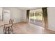 Dining area with sliding doors to backyard and light hardwood floors at 1192 Orlando Blvd, Port Charlotte, FL 33952