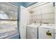 Laundry room with washer, dryer, and shelving at 5412 11Th Street E Cir # 41, Bradenton, FL 34203