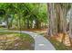 Serene community featuring lush landscaping, walking paths, and mature trees for a peaceful environment at 5412 11Th Street E Cir # 41, Bradenton, FL 34203