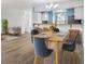 Light-filled dining area with modern furnishings and hardwood flooring, adjacent to the kitchen at 5412 11Th Street E Cir # 41, Bradenton, FL 34203