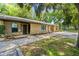Charming single-story home with stone accents, well-maintained lawn, and mature trees at 5412 11Th Street E Cir # 41, Bradenton, FL 34203