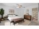 Inviting bedroom with a ceiling fan, neutral decor, and vintage furniture accents at 5412 11Th Street E Cir # 41, Bradenton, FL 34203