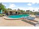 Inviting community pool with lounge chairs and a covered pavilion for relaxation and social gatherings at 5412 11Th Street E Cir # 41, Bradenton, FL 34203