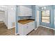 White kitchen cabinets and butcher block countertops at 5412 11Th Street E Cir # 41, Bradenton, FL 34203