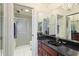 Bathroom boasts a large vanity with granite countertop at 4570 Pinebrook Cir # 603, Bradenton, FL 34209