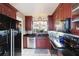Well-equipped kitchen with dark wood cabinets at 4570 Pinebrook Cir # 603, Bradenton, FL 34209