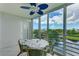 Sunroom with a table and chairs, offering scenic views at 4570 Pinebrook Cir # 603, Bradenton, FL 34209