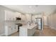 Modern kitchen with white cabinets and stainless steel appliances at 14551 Skipping Stone Loop, Parrish, FL 34219