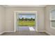 Office with sliding glass doors and view of grassy backyard at 14551 Skipping Stone Loop, Parrish, FL 34219