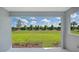Landscaped backyard with grassy lawn and hedge at 14551 Skipping Stone Loop, Parrish, FL 34219