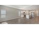 Open concept kitchen with white cabinets and island at 14551 Skipping Stone Loop, Parrish, FL 34219
