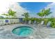 Soothing hot tub with surrounding lounge chairs at 14551 Skipping Stone Loop, Parrish, FL 34219