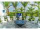 Cozy fire pit area with white Adirondack chairs at 14551 Skipping Stone Loop, Parrish, FL 34219
