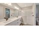 Modern bathroom boasts double vanity, quartz countertops, and a walk-in shower at 14551 Skipping Stone Loop, Parrish, FL 34219
