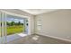 Office features sliding glass doors opening to a private patio and backyard at 14551 Skipping Stone Loop, Parrish, FL 34219