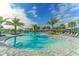Large freeform community pool with plenty of lounge chairs at 14551 Skipping Stone Loop, Parrish, FL 34219