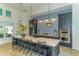 Well-equipped community kitchen featuring a large island and tile backsplash at 14551 Skipping Stone Loop, Parrish, FL 34219