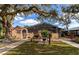 Community pool area with screened patio and seating at 19505 Quesada Ave # B204, Port Charlotte, FL 33948