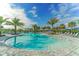 Large freeform pool with plenty of lounge chairs at 14705 Barefoot Ln, Parrish, FL 34219