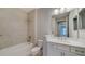 Clean bathroom with single vanity and bathtub at 14705 Barefoot Ln, Parrish, FL 34219