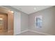 Well-lit bedroom with window and door to bathroom at 14705 Barefoot Ln, Parrish, FL 34219