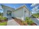 Side view of a light blue house with landscaping at 14705 Barefoot Ln, Parrish, FL 34219