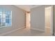 Bright bedroom with window, closet, and door to bathroom at 14705 Barefoot Ln, Parrish, FL 34219