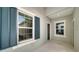 Front entrance with teal shutters and light walls at 14705 Barefoot Ln, Parrish, FL 34219